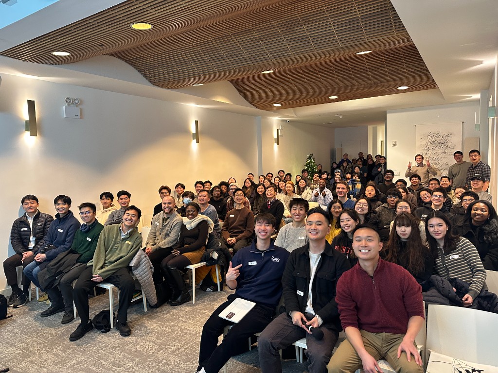 A diverse group of young adults from The Station gathered together